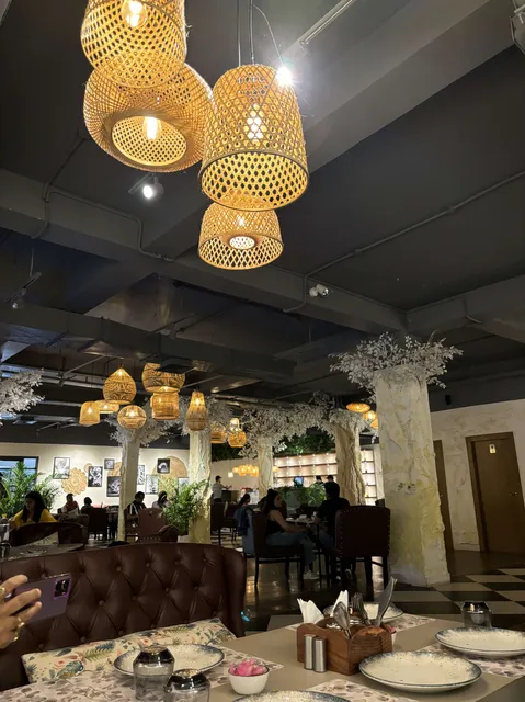 Cozy cafe dining room with woven wicker pendant lights